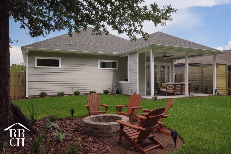 Custom Home Build Longleaf Exterior from Backyard with Outdoor Living Area and Firepit with Seating | Robinson Renovation & Custom Homes, Inc.