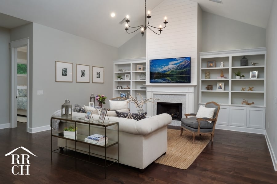 Custom Home Build Longleaf Living Area with Shiplap TV Wall with Fireplace and Custom Built-Ins Surrounding TV | Robinson Renovation & Custom Homes, Inc.