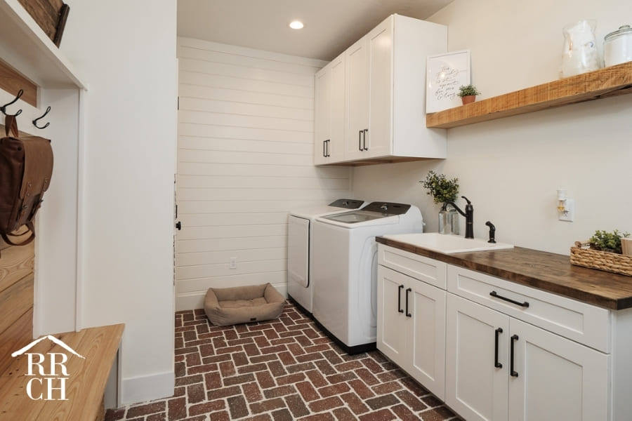 Custom Home Build Laundry Room and Mudroom with Custom Coat Rack - Dylans Grove 2 | Robinson Renovation & Custom Homes, Inc.