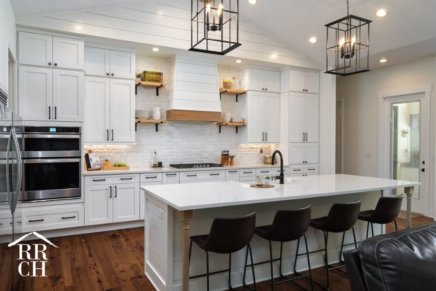 Custom Home Build Modern Farmhouse Kitchen Area Large Eat-In Island Floating Shelves - Dylans Grove 2 | Robinson Renovation & Custom Homes, Inc.