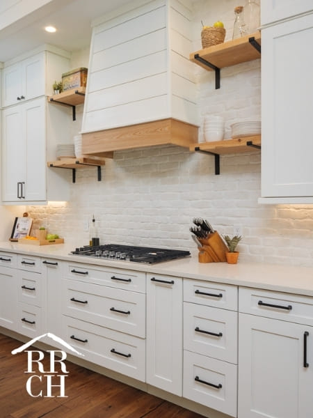 Custom Home Build Modern Farmhouse Style Kitchen Shiplap Hood Vent Subway Tile Backsplash Floating Shelves and Modern Drawer Pulls - Dylans Grove 2 | Robinson Renovation & Custom Homes, Inc.