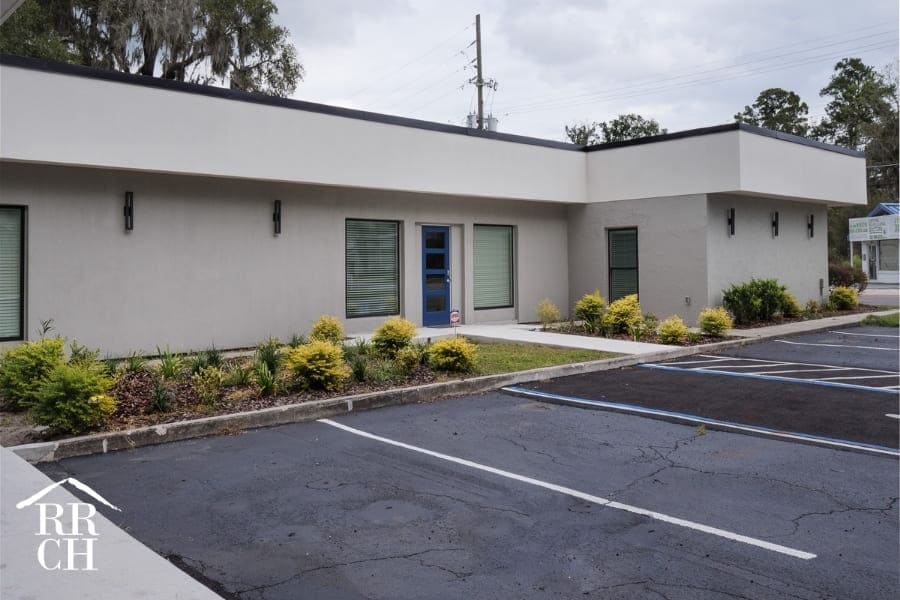 Modern White Office Commercial Remodel with Black Trim and Parking Lot Landscaping | Robinson Renovation and Custom Homes