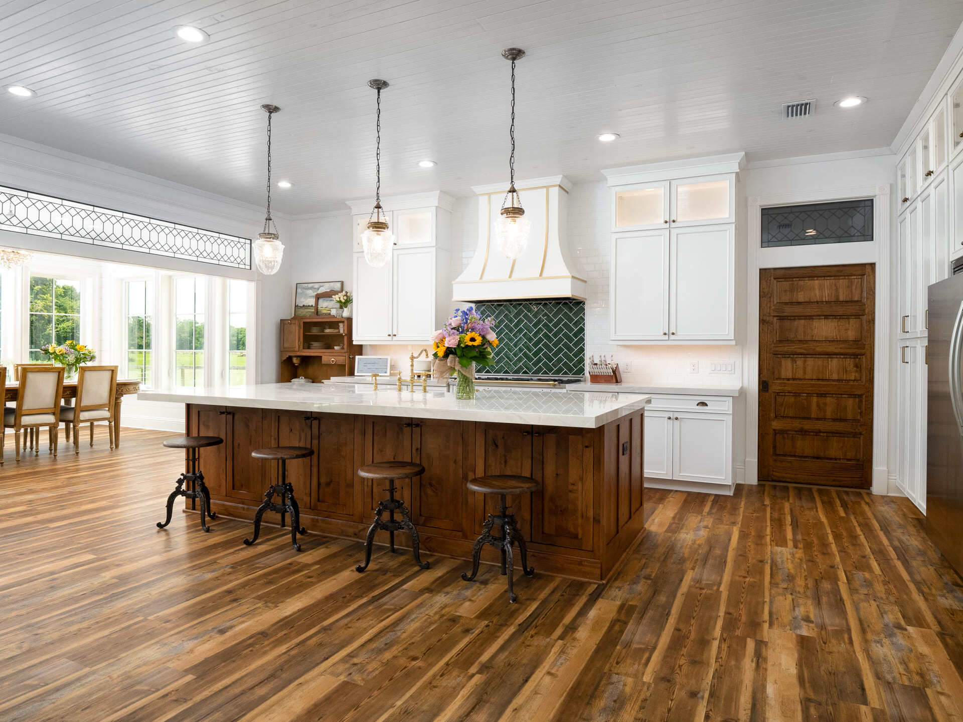 Kitchen with Natural Wood and Sunroom Dining Area in Custom Home Kitchen with Natural Wood and Sunroom Dining Area in Custom Home