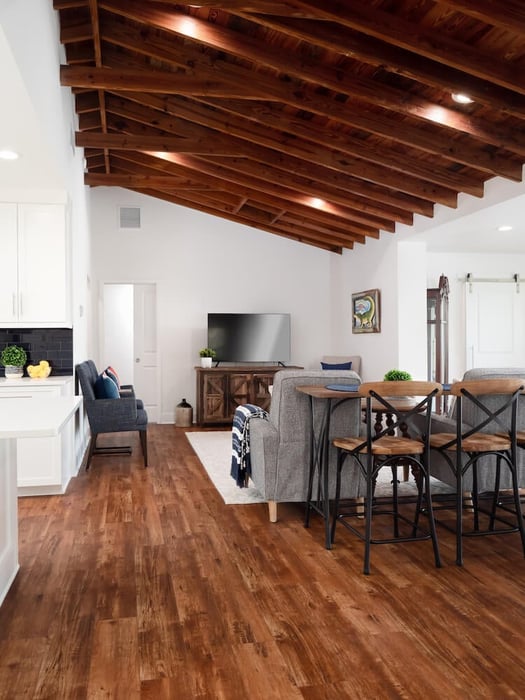 Living room with wood floors and wood beams