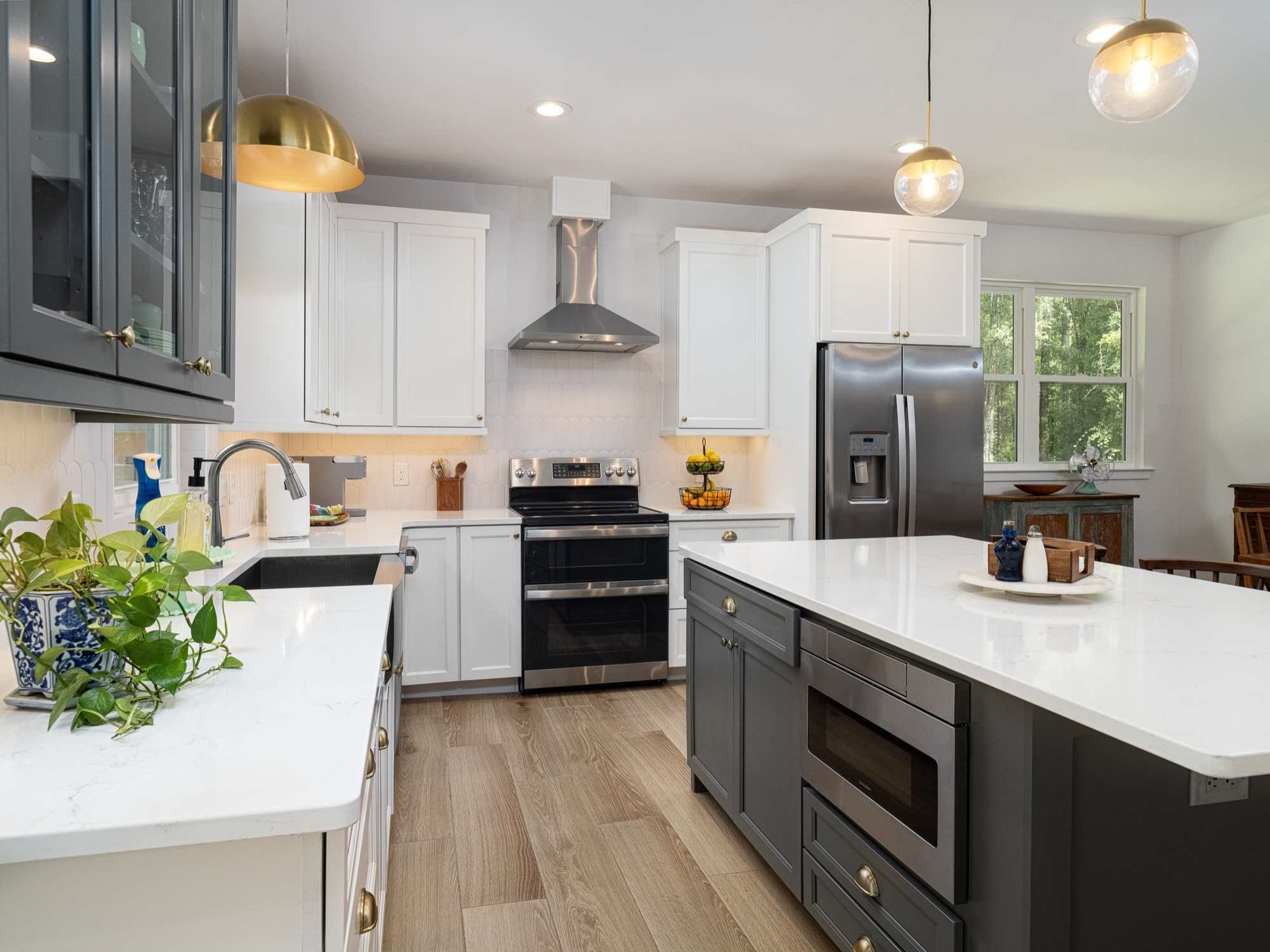 Bright custom kitchen in an ADU by RRCH in Alachua County, FL