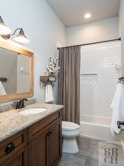 Subway Tiled Shower in Custom Full Bathroom 