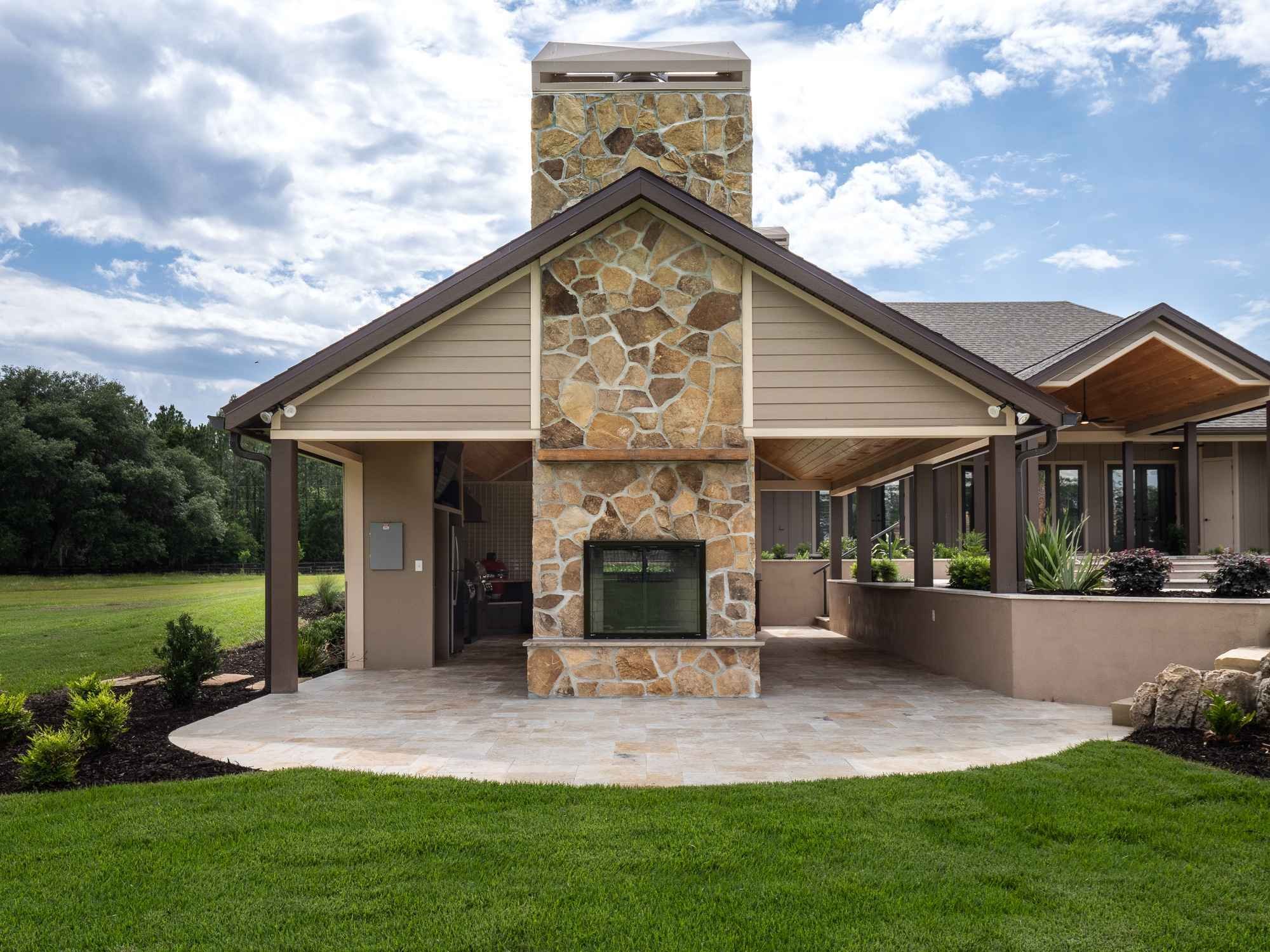 outdoor view of fireplace - High Springs Outdoor Addition | Robinson Renovation
