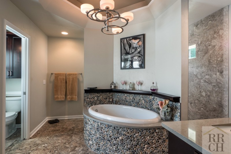 Custom Soaking Tub with River Stones in Bathroom Remodel