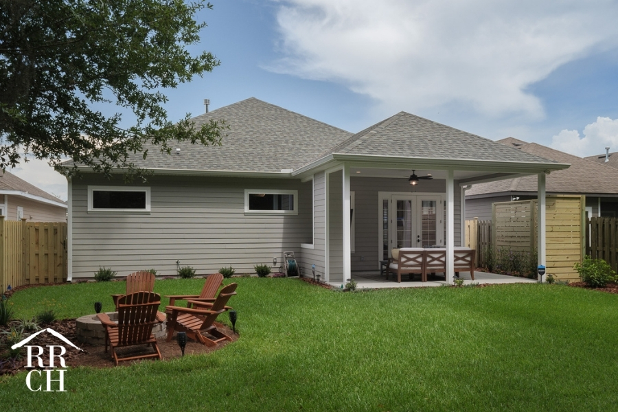 Custom Home Build Longleaf Exterior from Backyard with Outdoor Living Area | Robinson Renovation & Custom Homes, Inc.