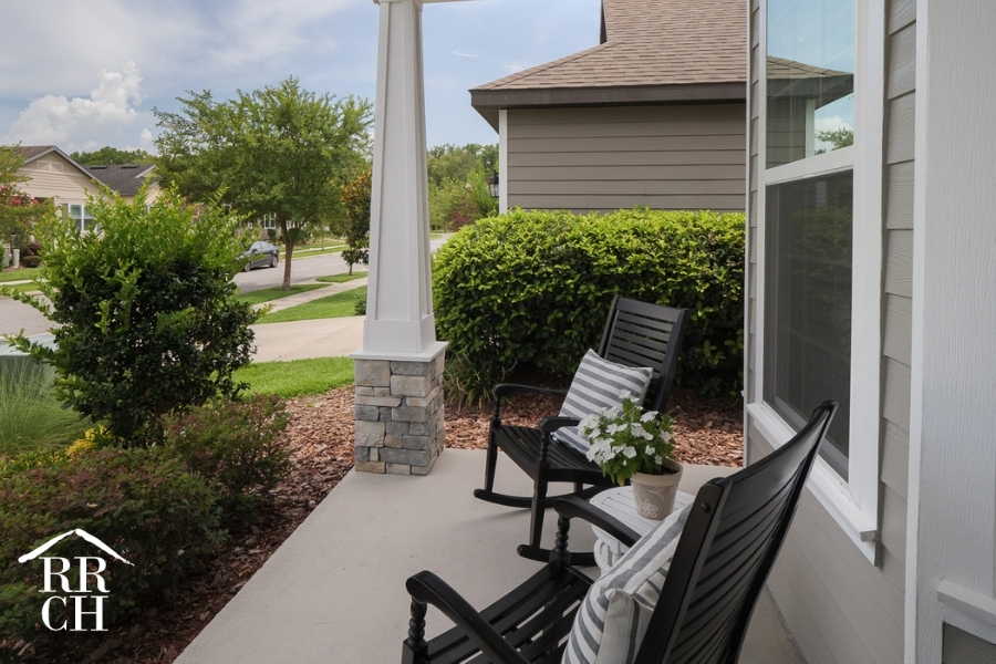 Custom Home Build Longleaf Front Porch Exterior with Patio Furniture | Robinson Renovation & Custom Homes, Inc.