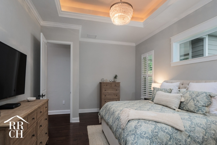 Custom Home Build Longleaf Master Bedroom with Tray Ceiling and Chandelier | Robinson Renovation & Custom Homes, Inc.