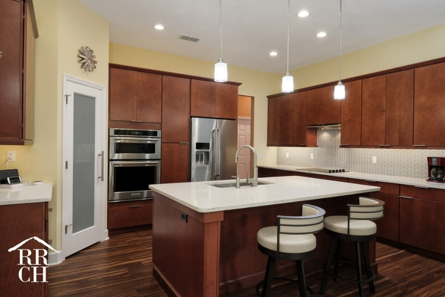 Eat-In Kitchen with Built-In Appliances and Modern Cabinet Fixtures | Robinson Renovations and Custom Homes