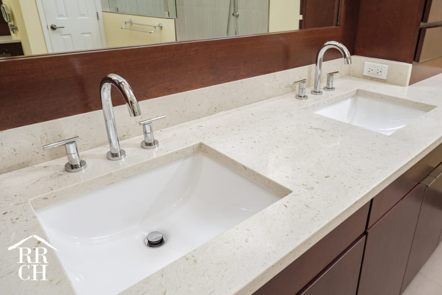 His and Hers Sinks in Modern Bathroom Remodel and Brown Wood Cabinetry | Robinson Renovations and Custom Homes