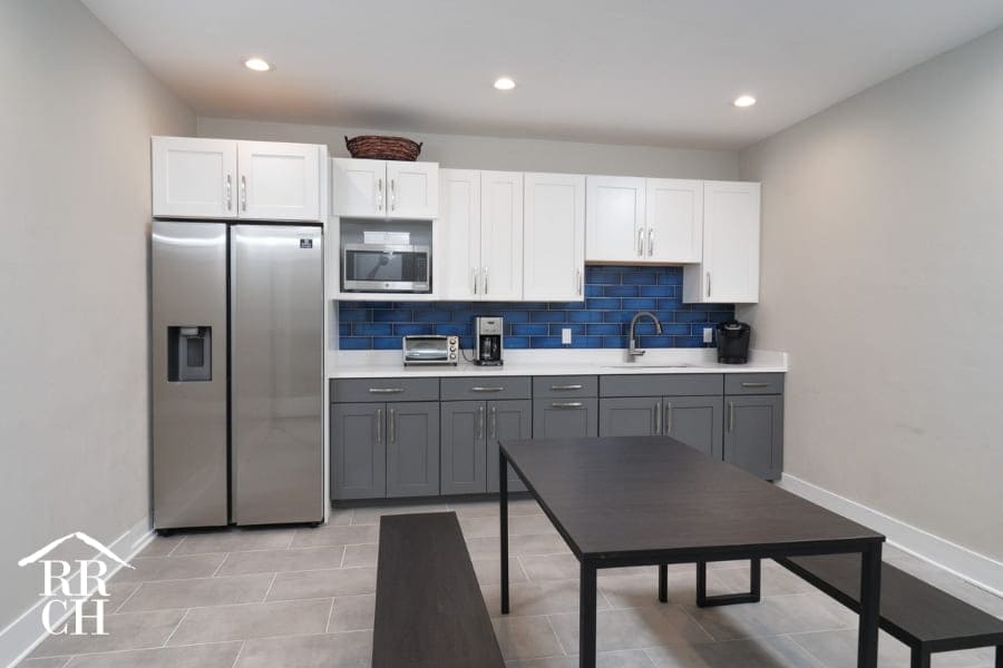 Beautiful Staff Kitchen with Grey and White Cabinets Inside Commercial Office Building Renovation Project | Robinson Renovation and Custom Homes