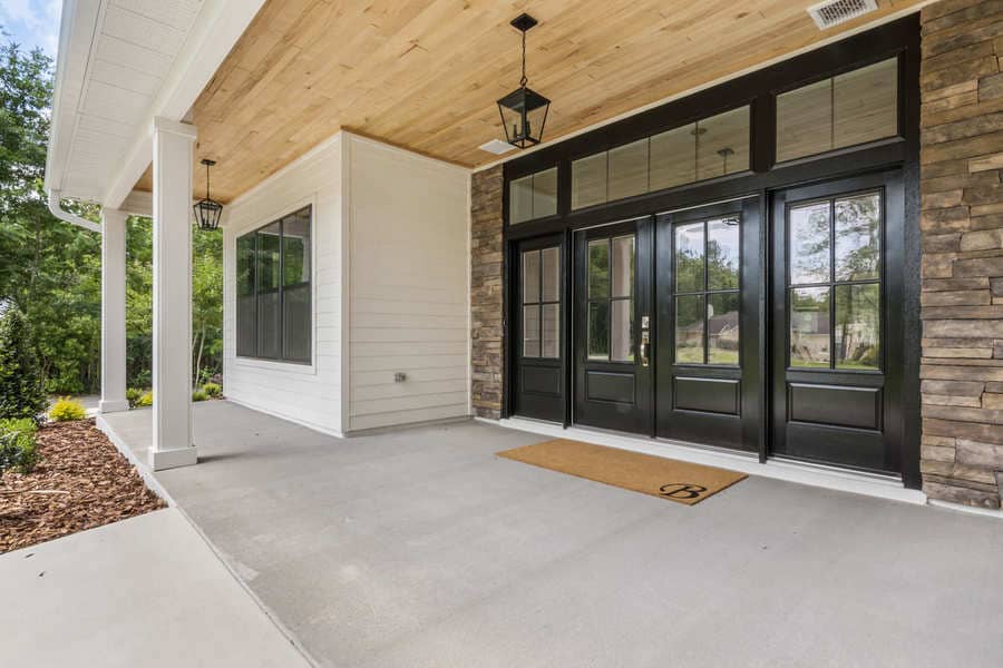 Fletcher Park Lot 5 Back Patio with Aluminum Frame Sliding Doors in Modern Farmhouse Custom Home in Gainesville, FL