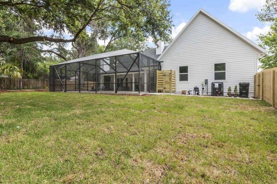 Fletcher Park Lot 5 Pool Cage and Landscaping of Modern Farmhouse Custom Home in Gainesville, FL
