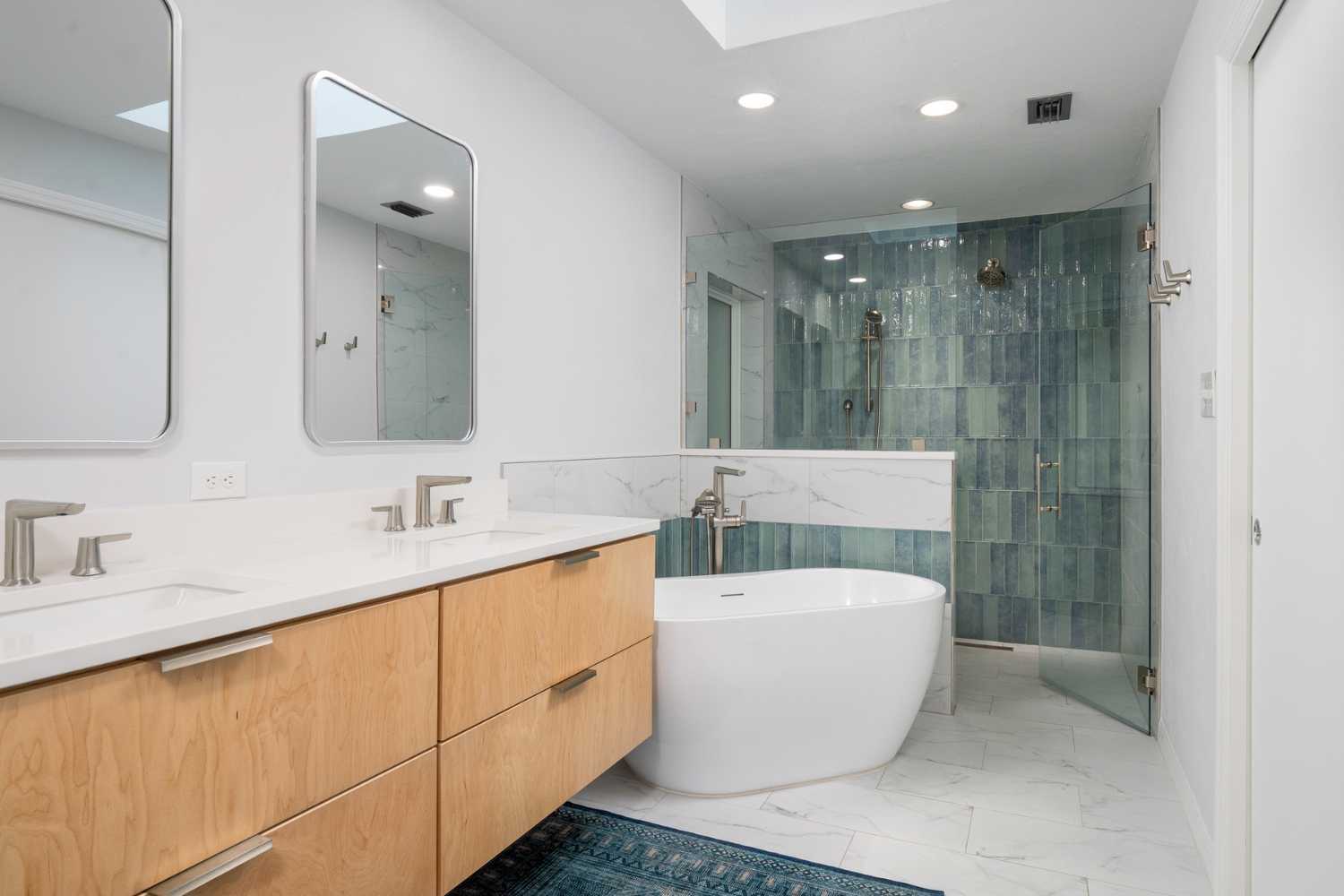 Remodeled bathroom with walk in shower, soaking tub, dual sink floating vanity by RRCH Remodeled bathroom with walk in shower, soaking tub, dual sink floating vanity by RRCH